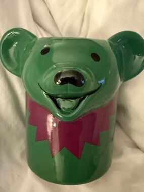 Grateful Dead Dancing Bear ceramic mug green mascot with a magenta collar. 16oz